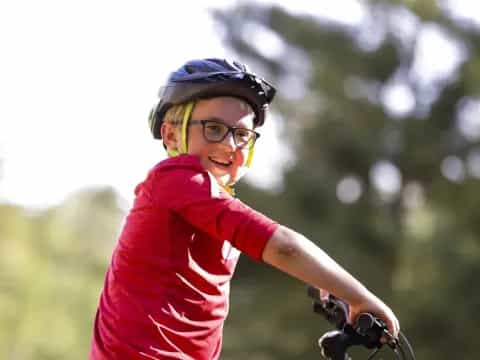 a boy riding a bike