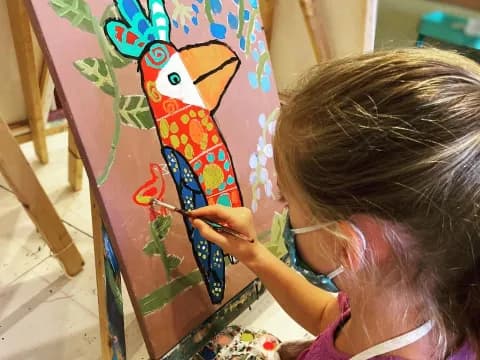 a young girl painting