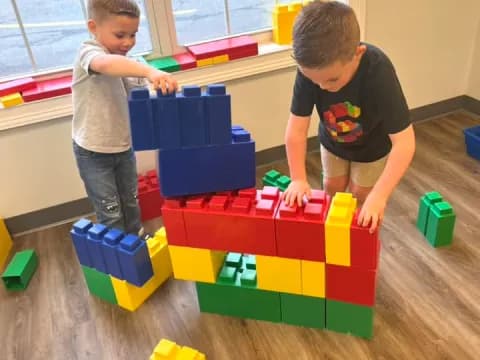two boys playing with toys
