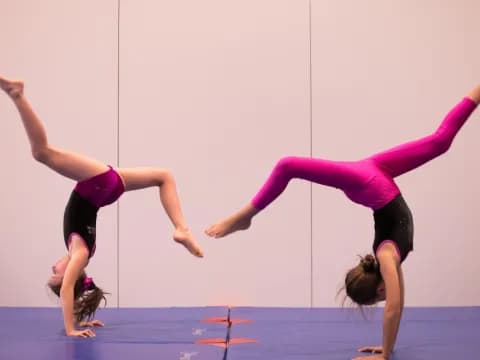 a couple of women doing yoga