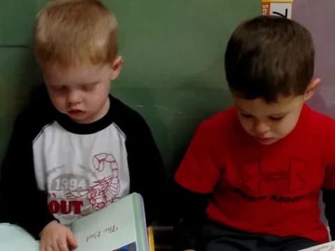 a couple of boys reading books