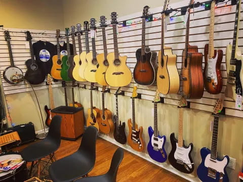 a wall with guitars on it