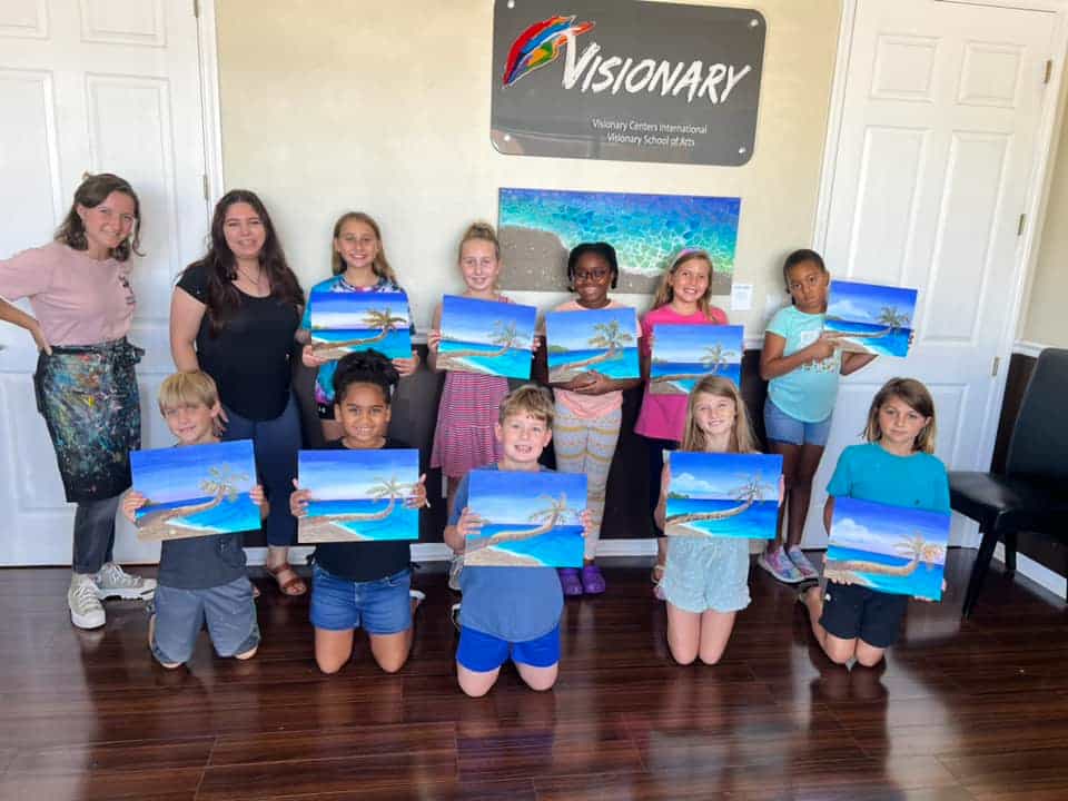 a group of children holding blue and white signs