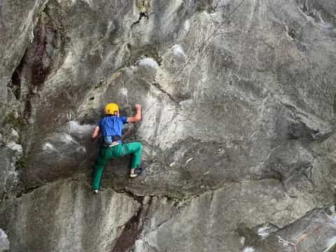 a man climbing a rock