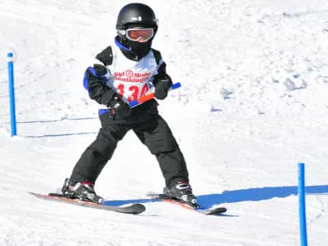 a kid skiing down a slope