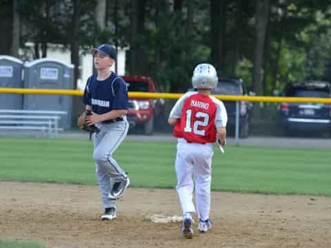 a couple of young boys playing baseball