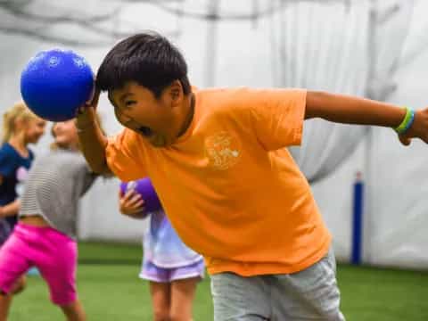 a boy hitting a ball with his head