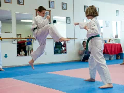a couple of boys practicing karate