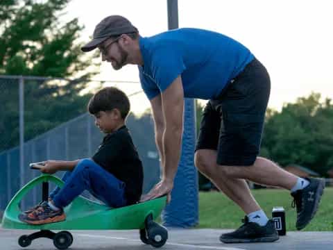a man and a boy riding skateboards