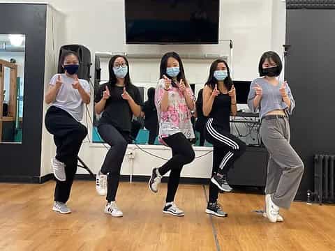 a group of women wearing masks