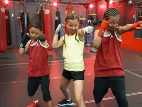 a group of kids in a boxing ring