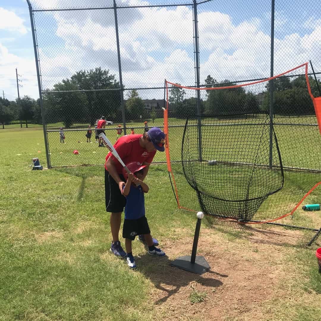a person swinging a baseball bat