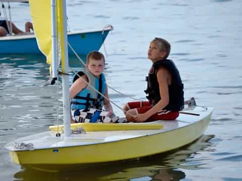 two boys on a small boat