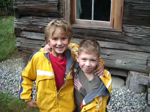 two boys in yellow jackets