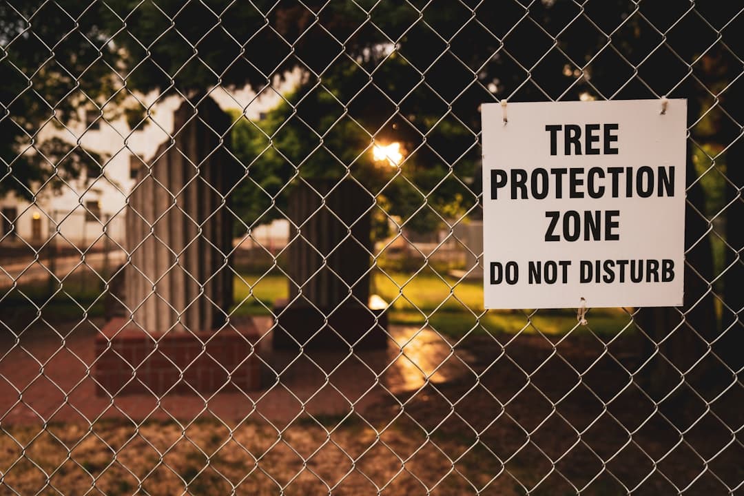 Tree Protection Zone board hanging on chain link fence