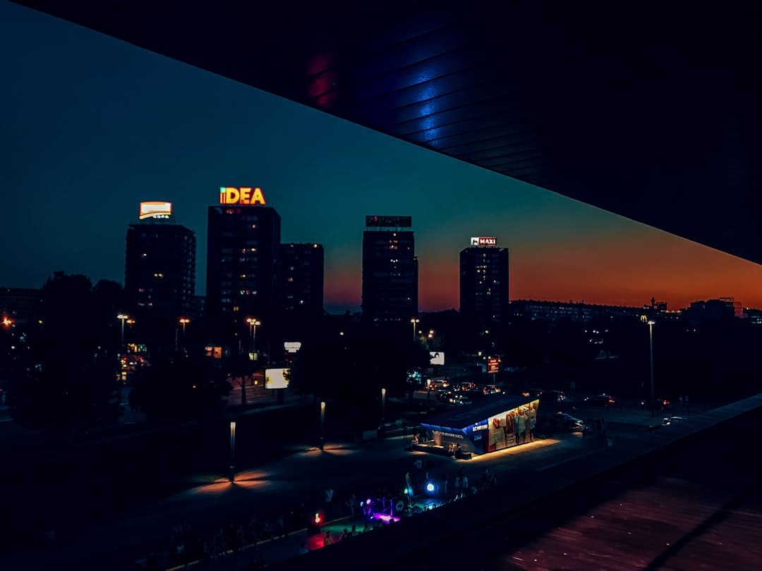 a view of a city at night from a balcony