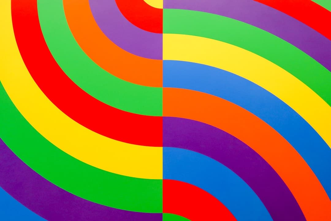 a multicolored painting of a spiral design