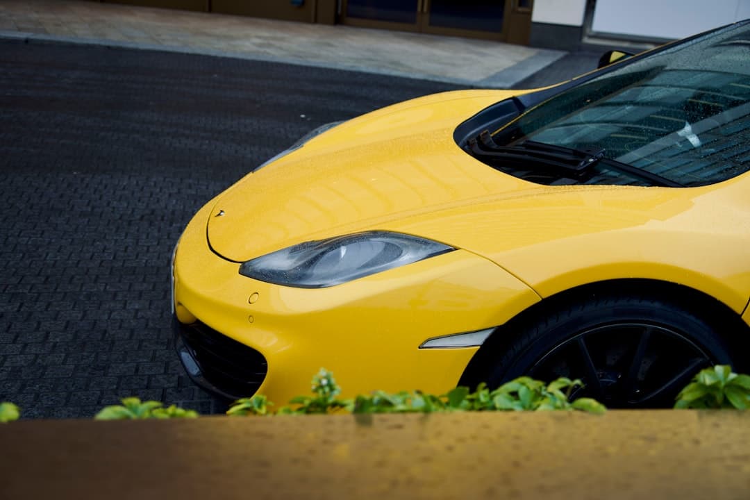 a yellow sports car parked in a parking lot